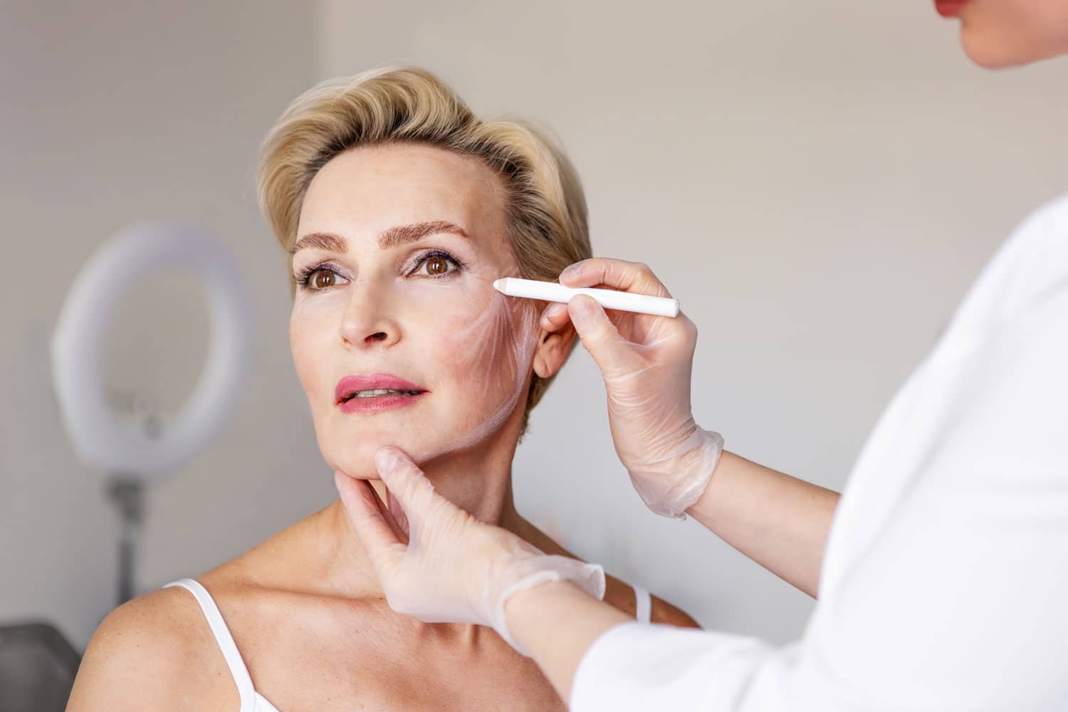 Woman being prepped for cosmetic or aesthetic procedure
